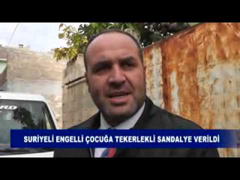 Suriyeli engelli çocuğa tekerlekli sandalye verildi